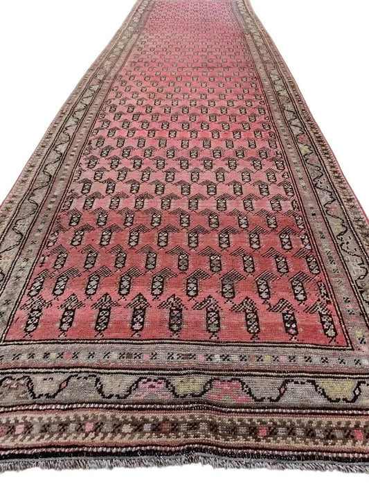 Antique Armenian Karabakh wool runner rug in pink, hand-knotted with dark motifs and borders on Tampa Home & Garden Store