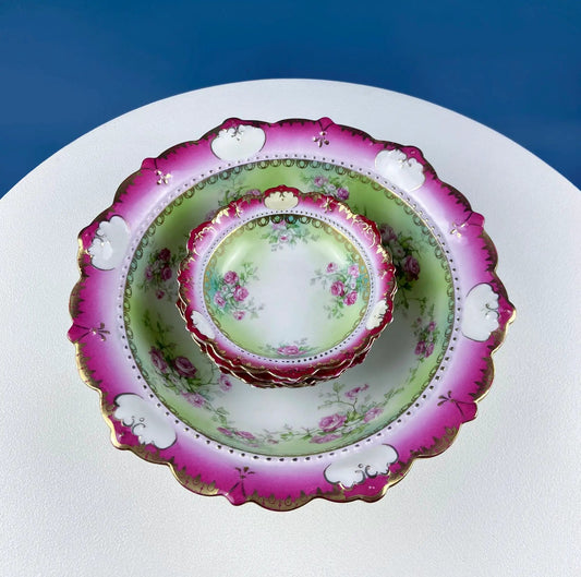Antique Austrian porcelain serving bowls set with pink scalloped rims and green floral centers on Tampa Home & Garden Store