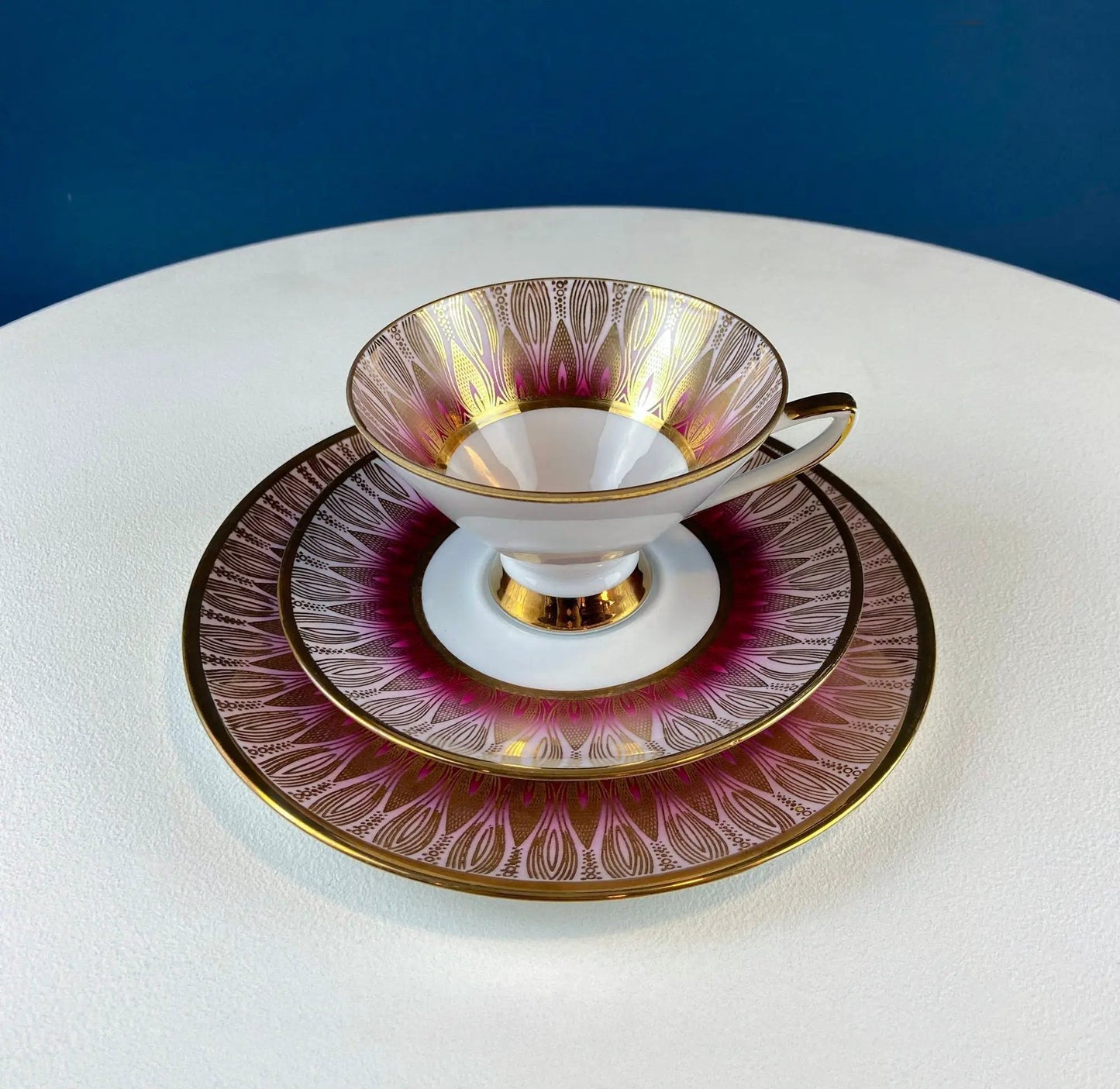 Antique Bavarian porcelain tea set trio: gold-trimmed cup and two pink-gradient saucers on Tampa Home & Garden Store