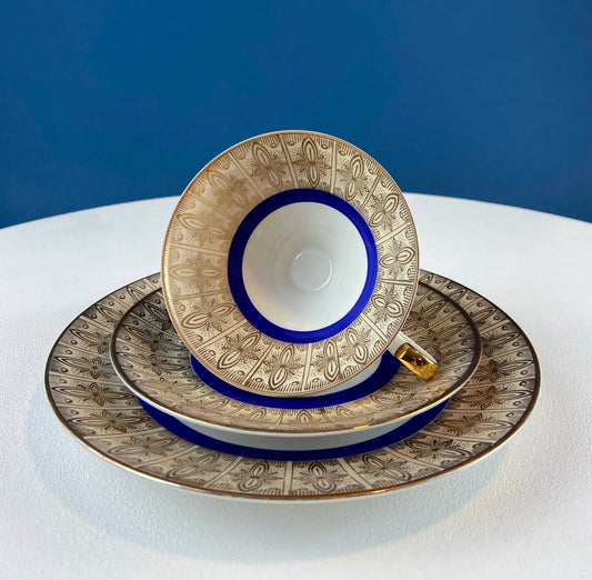 Teacup and saucer set, tea trio; Bavarian porcelain with blue rim and gold pattern on Tampa Home & Garden Store