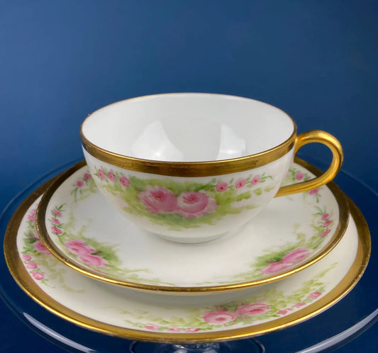 Antique Bavarian porcelain teacup and saucer trio with pink rose garlands and gold trim on Tampa Home & Garden Store