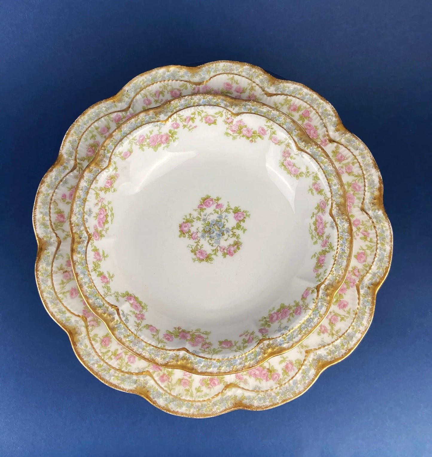 Antique Bavarian porcelain teacup and saucer trio with pink rose garlands and gilded rims on Tampa Home & Garden Store