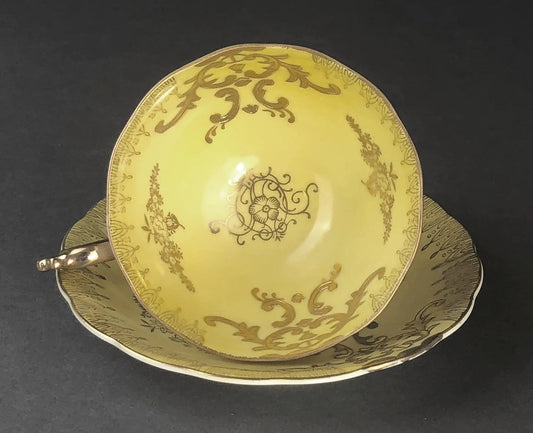 Antique Cup and Saucer Set yellow china with gold scrollwork and floral border on Tampa Home & Garden Store