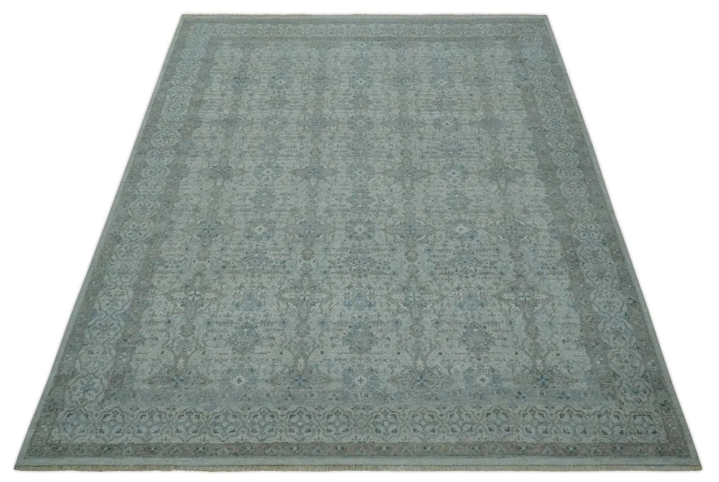 Antique distressed wool ikat area rug in silver teal, hand-knotted with intricate pattern on Tampa Home & Garden Store
