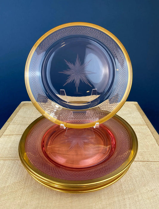 Antique etched pink glass dinner plates with gold rims, stacked in blue and pink tones on Tampa Home & Garden Store