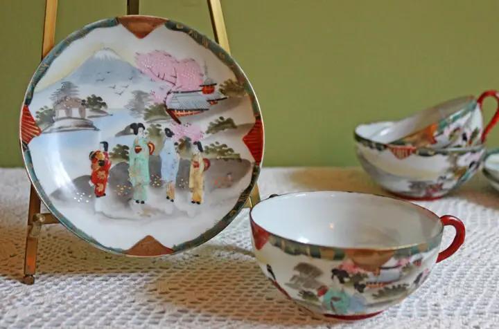 Antique hand-painted tea cup with Asian motif in thin porcelain; matching plate on Tampa Home & Garden Store