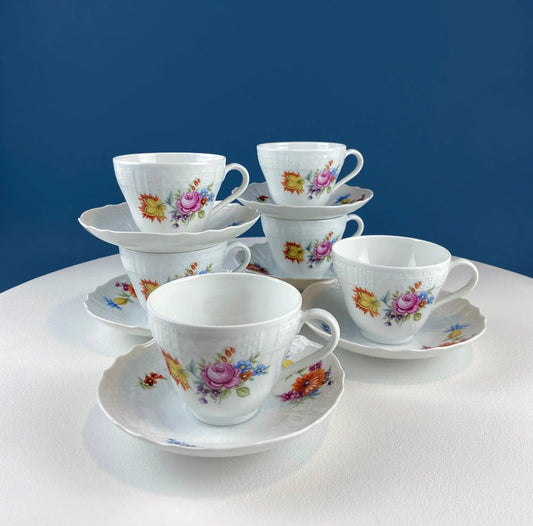 Hutschenreuther porcelain tea set with floral motif; teacups and saucers on a tiered display on Tampa Home & Garden Store