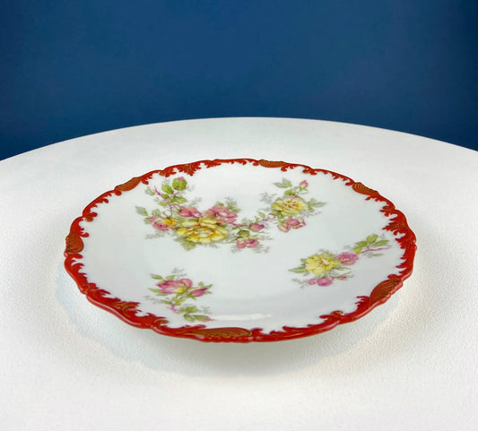 Antique Limoges plate with floral roses and a red scalloped rim on Tampa Home & Garden Store