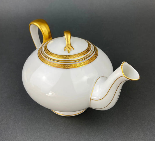 Antique Limoges porcelain teapot with white glaze and gold trim ornate lid knob on Tampa Home & Garden Store