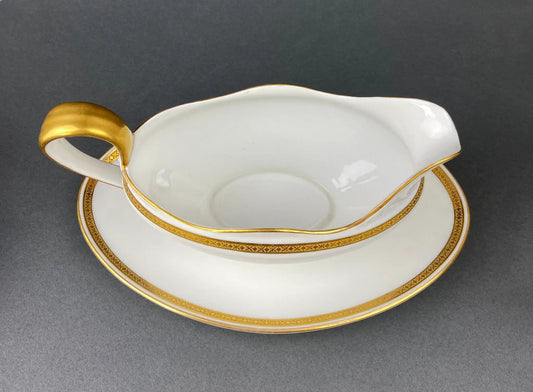 Antique Limoges porcelain gravy boat with gold trim and curved gold handle by Haviland France on Tampa Home & Garden Store