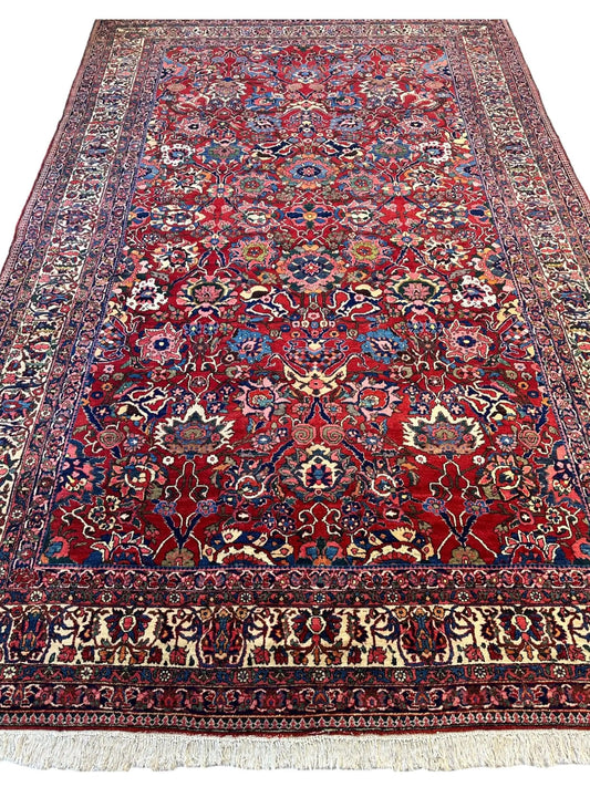 Antique Persian Bakhtiari Area Rug, deep red field with colorful floral medallions Rugistan on Tampa Home & Garden Store