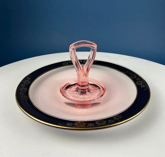 Antique pink glass serving plate with center handle and navy rim featuring gold floral trim on Tampa Home & Garden Store