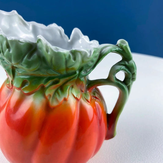 Tomato jug sugar creamer in Royal Bayreuth porcelain, red body with green leaf rim and handle on Tampa Home & Garden Store