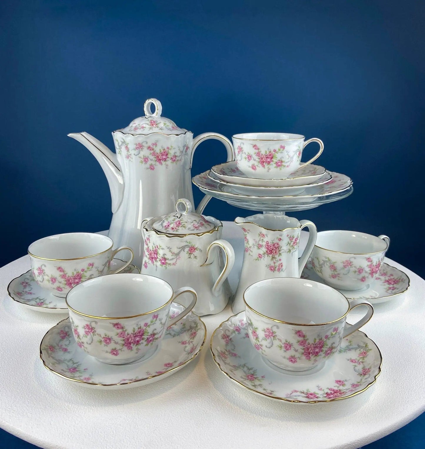 Antique porcelain serving platters and bowls by Hutschenreuter with garland and gold trim on Tampa Home & Garden Store