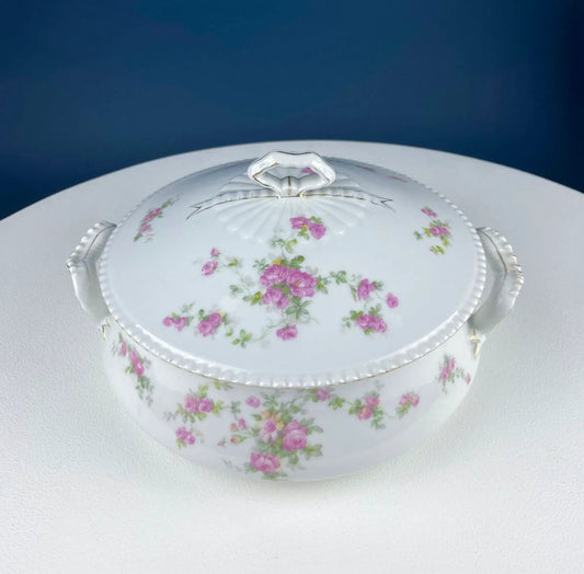 Antique porcelain tureen with pink rose pattern and bow-shaped lid handle on Tampa Home & Garden Store