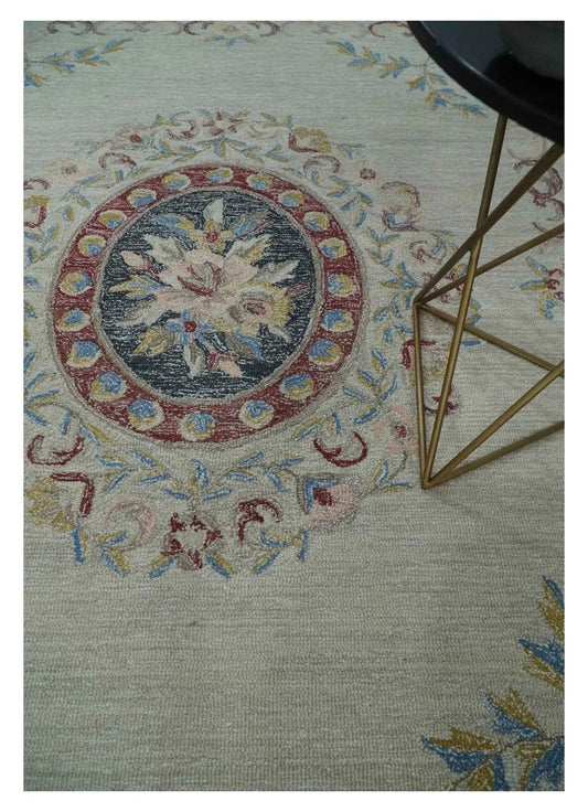 Antique beige Aubusson wool area rug with a multicolor medallion, 8x10 on Tampa Home & Garden Store