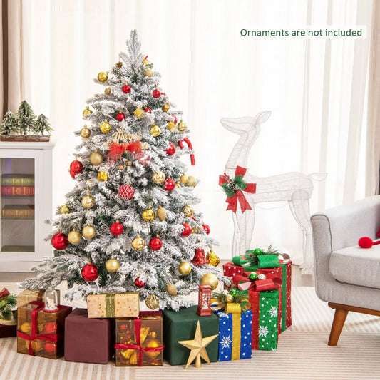 Flocked Christmas tree with warm white LED lights and red, gold ornaments, surrounded by gifts on Tampa Home & Garden Store