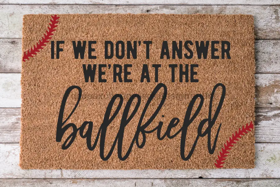 Door mat At the Ball Field 30x18 coir with brown surface and bold ballfield script DecoExchange on Tampa Home & Garden Store
