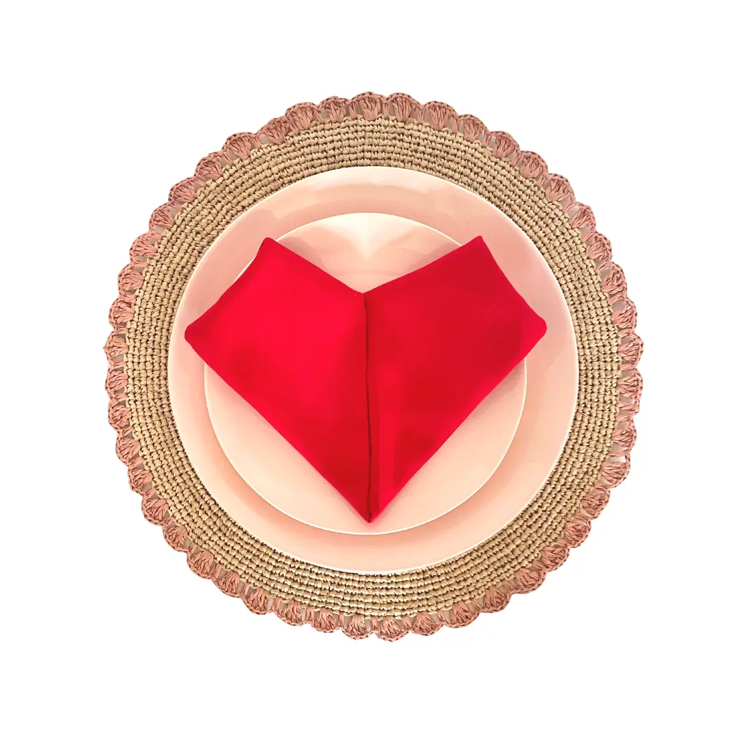 Aura Pink Edge Placemat and Raffia Mat pink-edged raffia placemat with pink plate and red napkin on Tampa Home & Garden Store