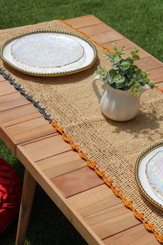 Aura Raffia Table Runner with Colorful Edges, natural raffia weave with orange fringe and blue trim on Tampa Home & Garden Store