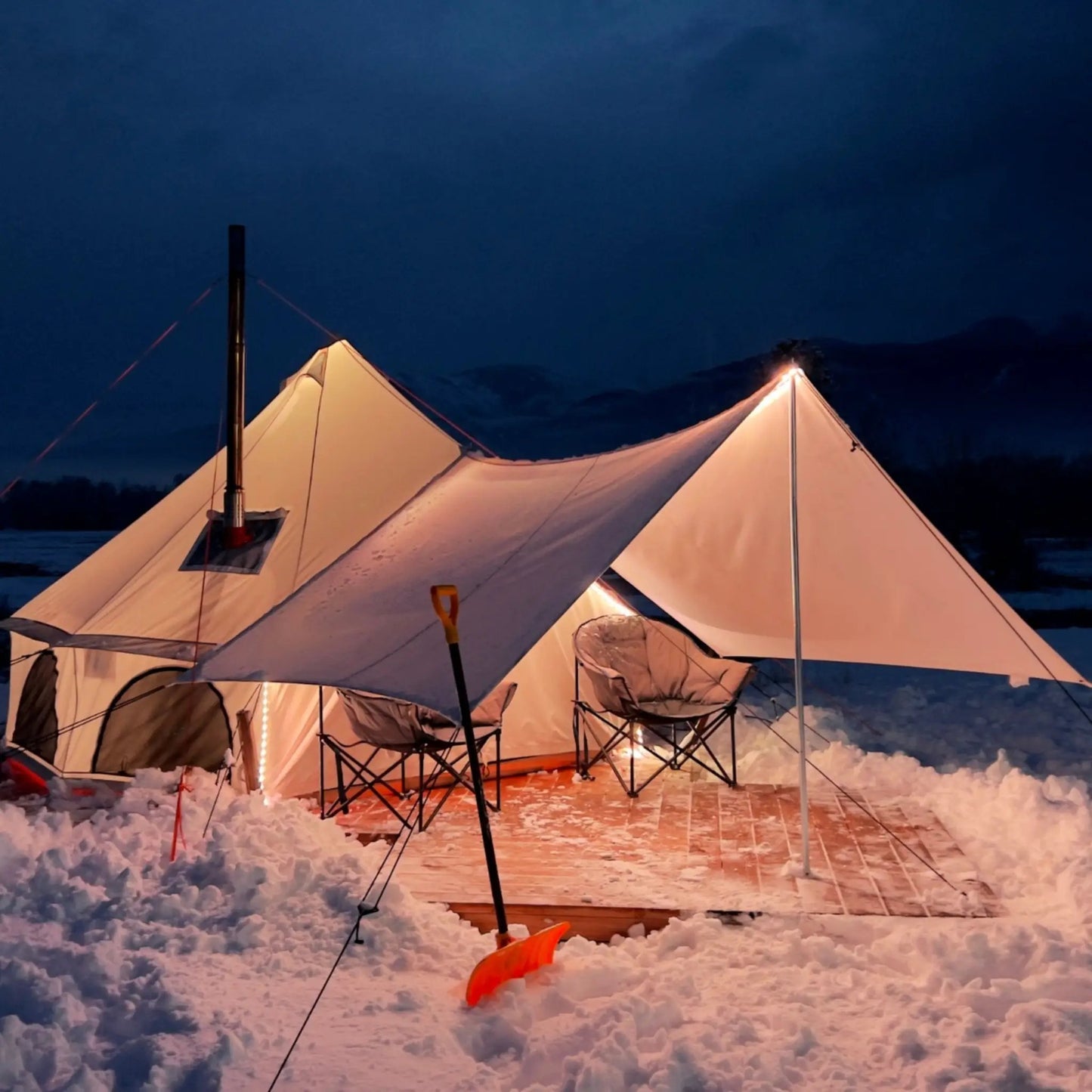 Avalon Bell Tent white canvas with poles and carry bag at night on snow on Tampa Home & Garden Store