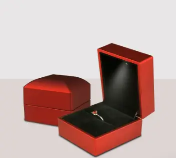Elegant red LED ring box open to reveal a ring, with a closed matching box beside it on Tampa Home & Garden Store