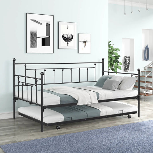 Black metal double bed frame with noise-reduction feature and rounded finials in a blue bedroom on Tampa Home & Garden Store