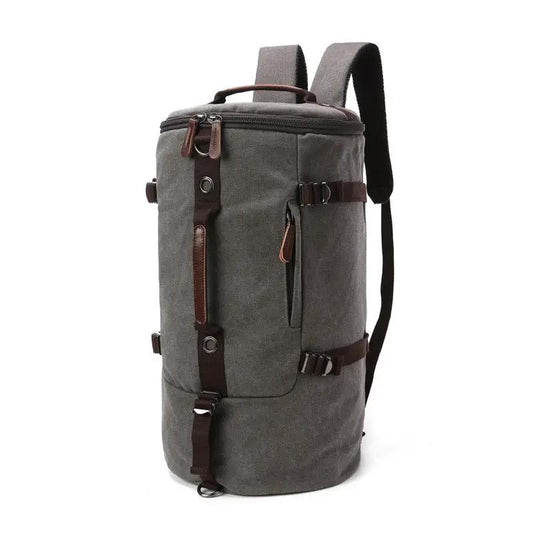 Men's canvas travel backpack in gray with brown leather trim and multiple zip pockets on Tampa Home & Garden Store