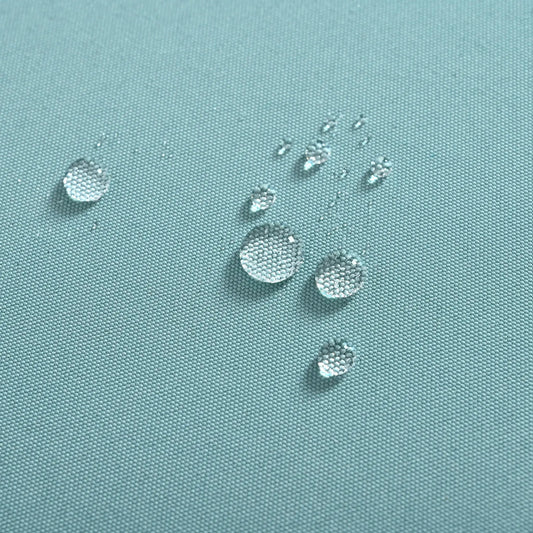 Patio furniture set wicker four piece with table blue woven fabric close-up with water droplets on Tampa Home & Garden Store