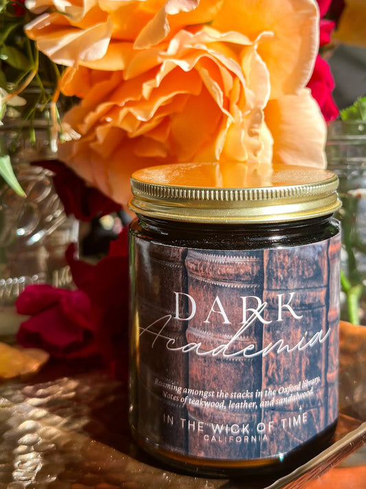 Dark Academia Candle in an amber jar with gold lid, leather and wood notes, In the Wick of Time on Tampa Home & Garden Store