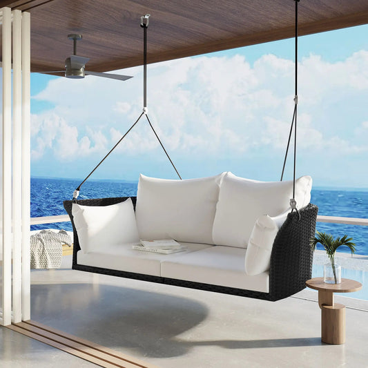 Go Two Person Hanging Seat and Rattan Swing Chair with white cushions on a seaside porch on Tampa Home & Garden Store