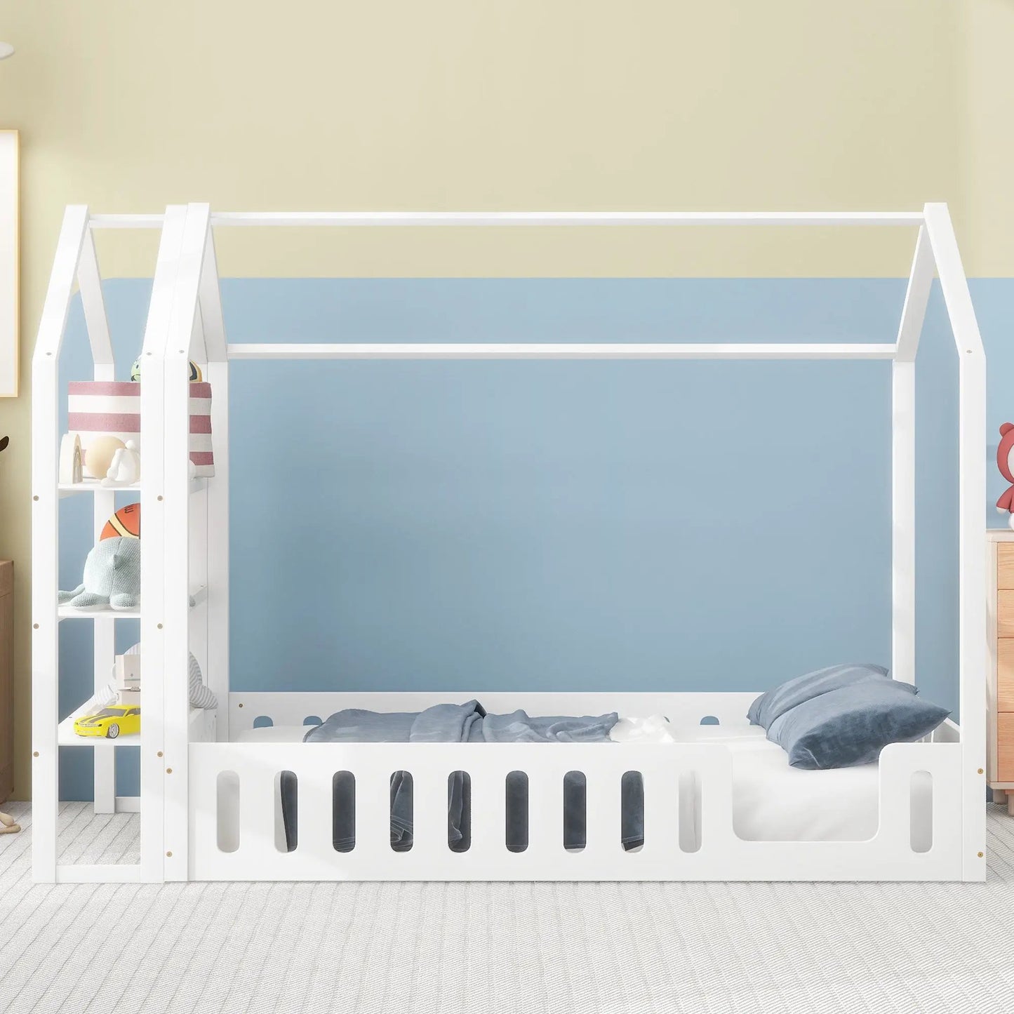 Full-size wooden house bed with white finish, fence railings and left-side shelves for kids room on Tampa Home & Garden Store