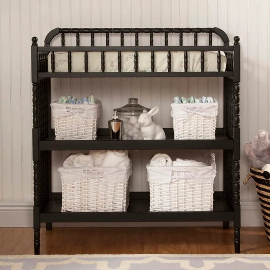 Black wood changing table with waterproof pad and white wicker baskets for nursery storage on Tampa Home & Garden Store