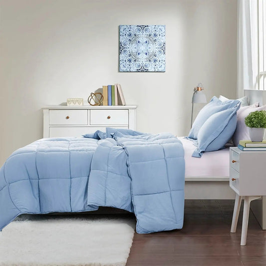 Queen Blue Microfiber Reversible Comforter Set on bed with light blue pillows in a clean bedroom on Tampa Home & Garden Store