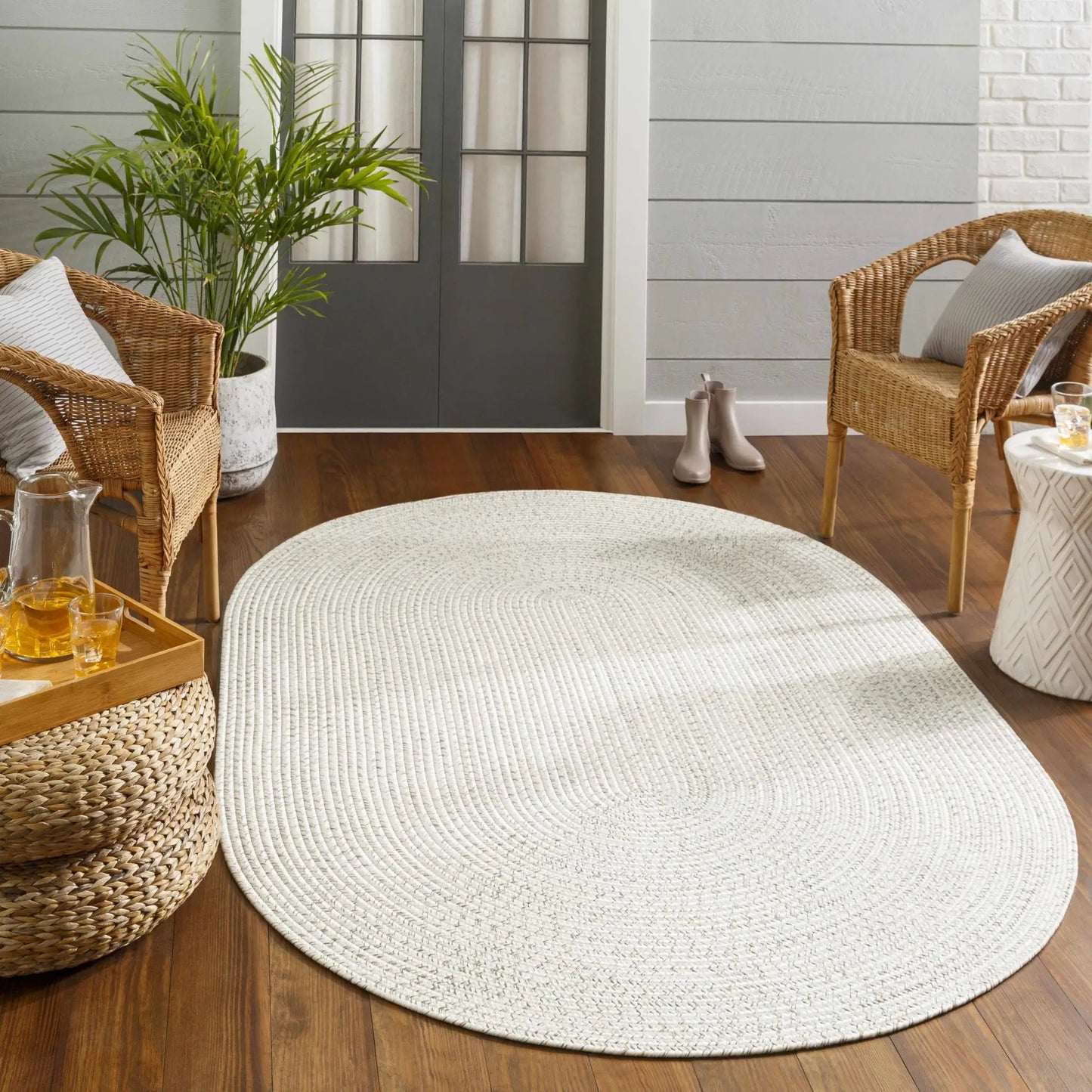 Beige braided faux jute outdoor rug by Boutique Rugs on Tampa Home & Garden Store