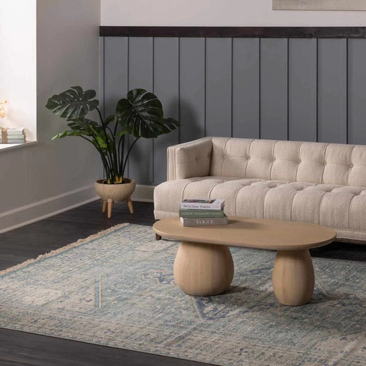 Byers Handmade Cotton Blend Aqua Rug Hand Woven in a living room with beige tufted sofa on Tampa Home & Garden Store