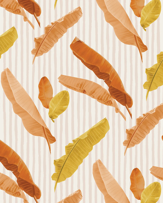 Wallpaper Banana Cabana with rust and mustard tropical leaves over a light striped background on Tampa Home & Garden Store
