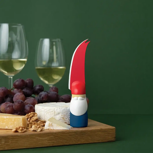 Bert cheese knife by OTOTO Design, red curved blade and blue base handle on a cheese board on Tampa Home & Garden Store