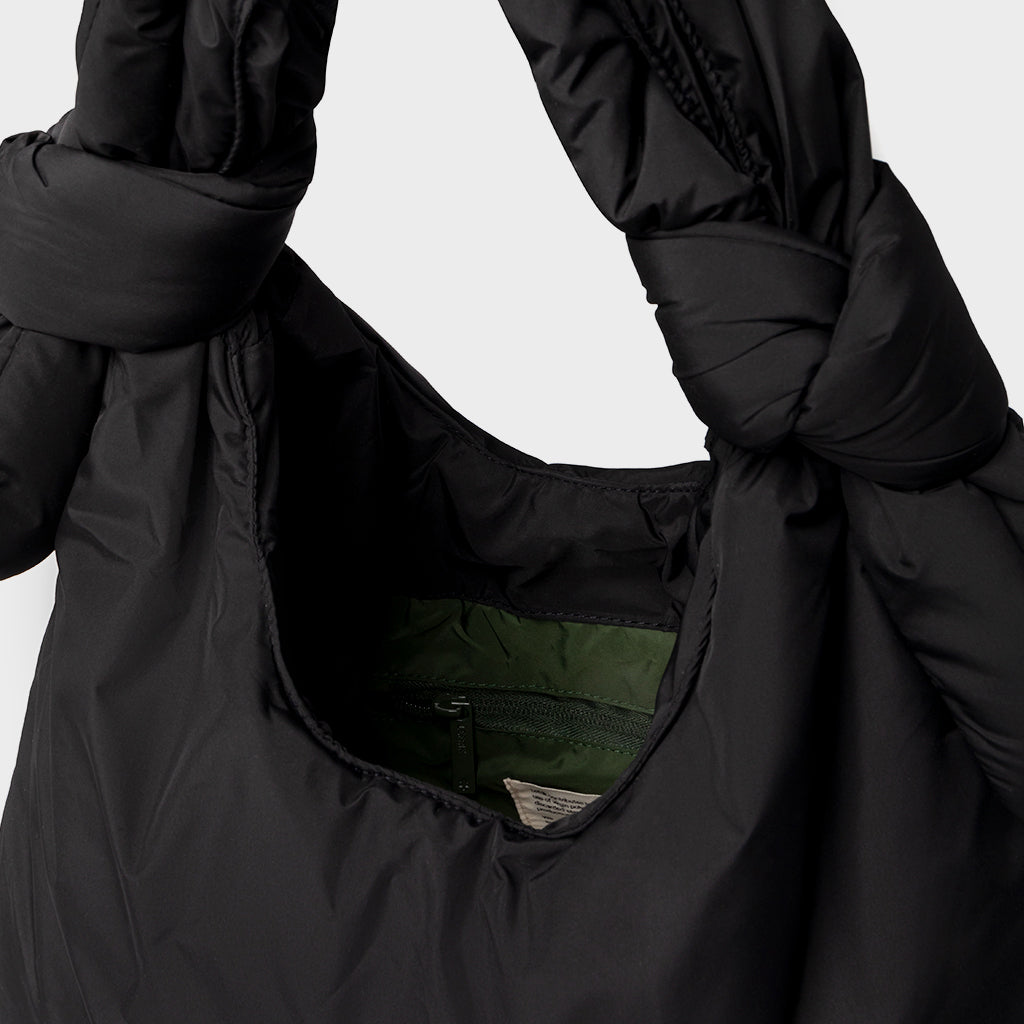 Biwa Puffy Black Quilted Crossbody Bag by Lefrik USA with green interior and zip pocket on Tampa Home & Garden Store