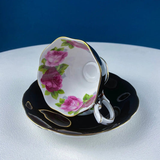 Black teacup and saucer with pink roses and gold trim, Royal Albert Old Country Rose on Tampa Home & Garden Store
