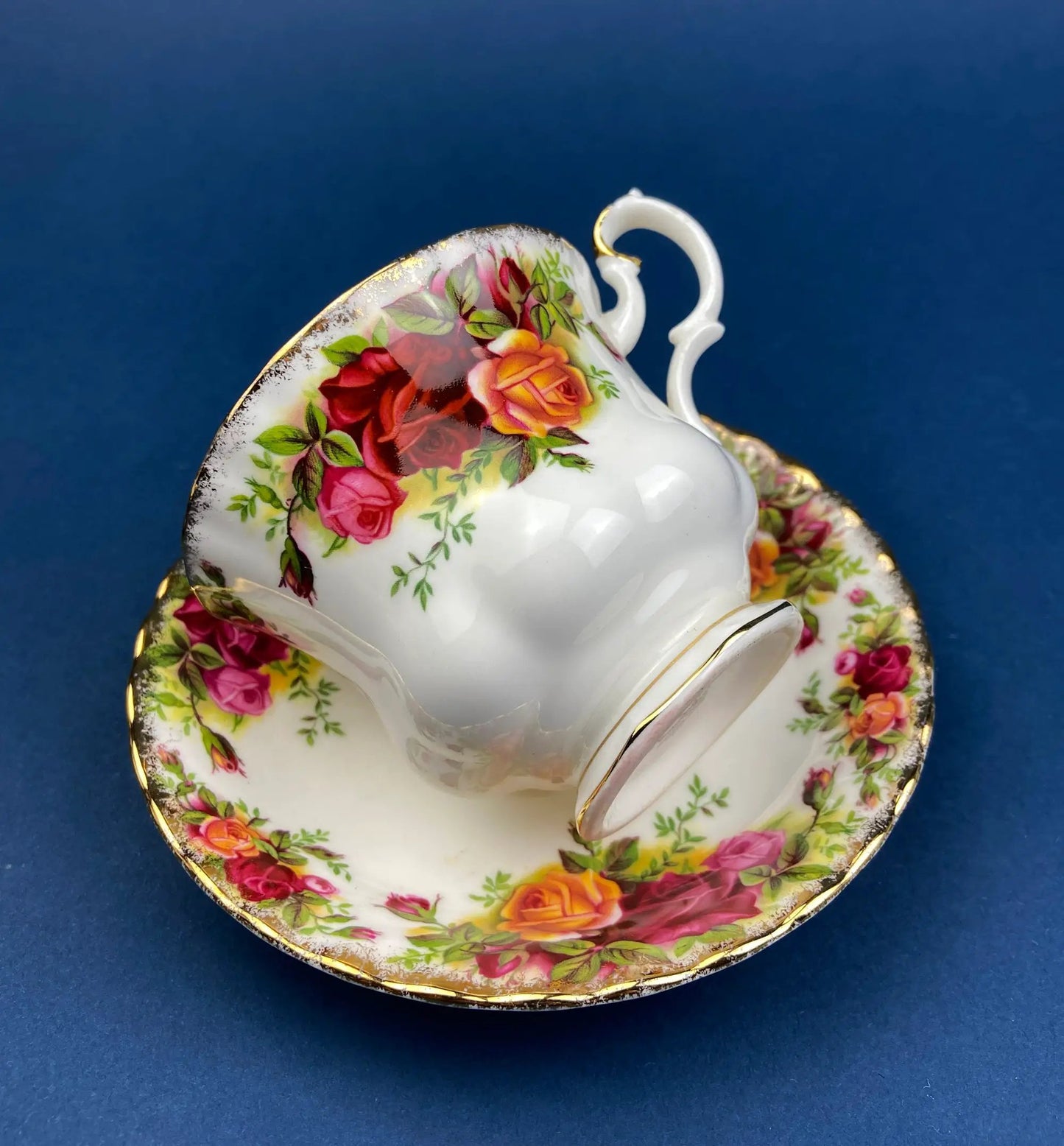 Teacup and saucer set in Old Country Roses floral pattern, white porcelain with gold trim on Tampa Home & Garden Store