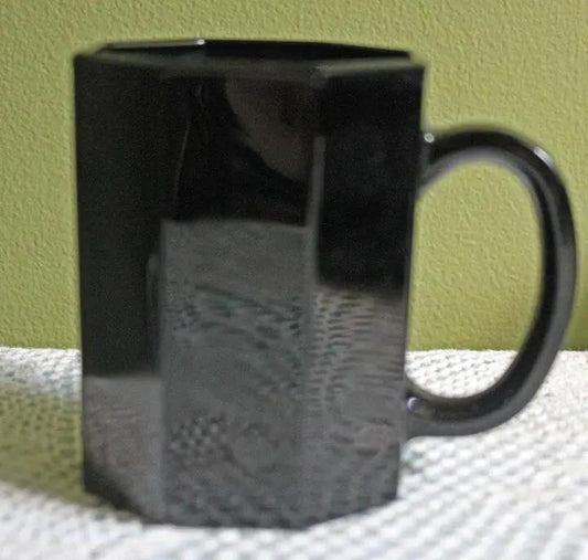 Black glass mug with octagonal facets and curved handle on Tampa Home & Garden Store