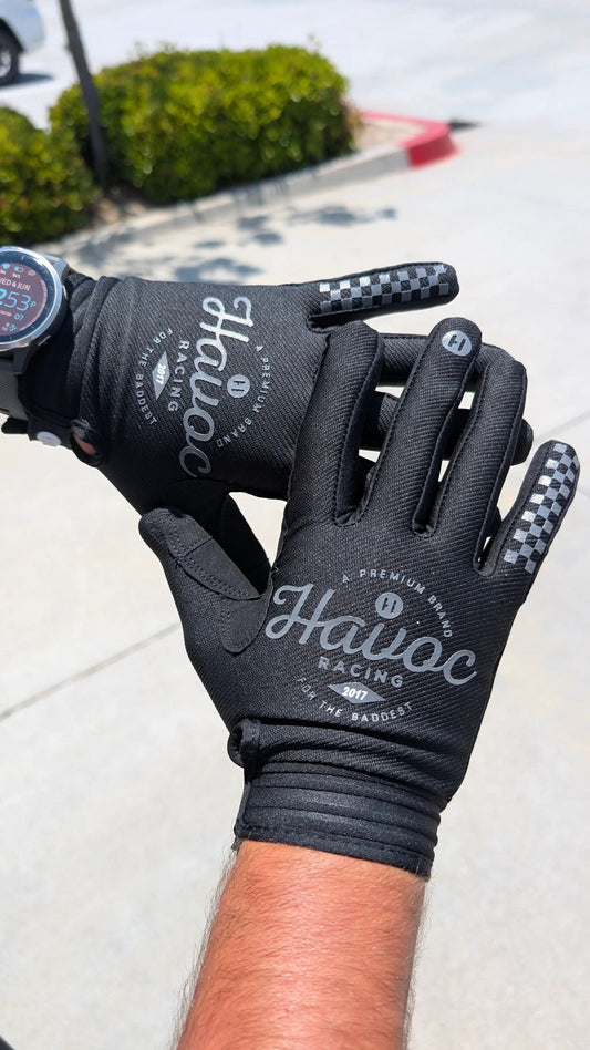 Motorcycle gloves Black Havoc Racing gloves with checkered fingertip accents and Havoc branding on Tampa Home & Garden Store