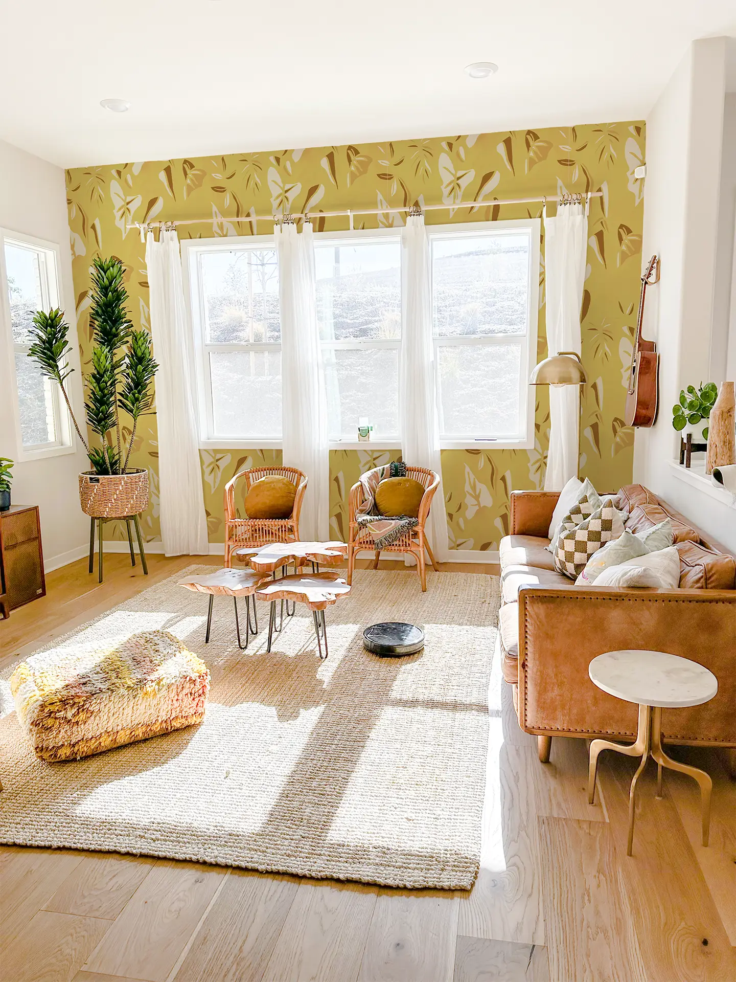 Block Print Foliage Wallpaper Yellow on sunlit living room wall with white sheer curtains on Tampa Home & Garden Store