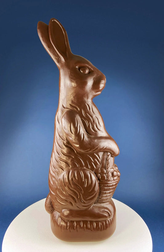 Chocolate blow mold bunny statue holding an egg basket for Easter display on Tampa Home & Garden Store