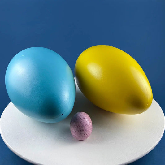 Blow-molded oversized Easter eggs blue and yellow; set of 2 on white plate on Tampa Home & Garden Store