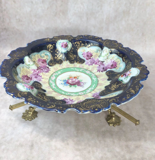 Antique porcelain bowl with ornate gold stand; cobalt blue exterior, floral interior on Tampa Home & Garden Store