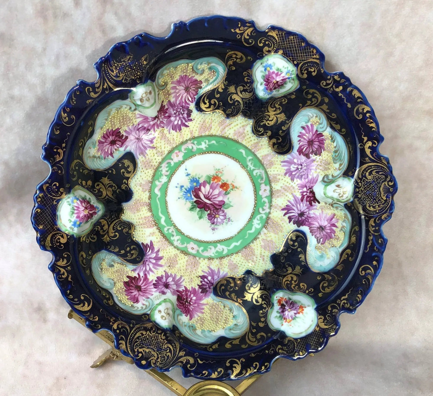 Antique hand-decorated porcelain bowl with gold stand; cobalt blue rim and pink florals on Tampa Home & Garden Store