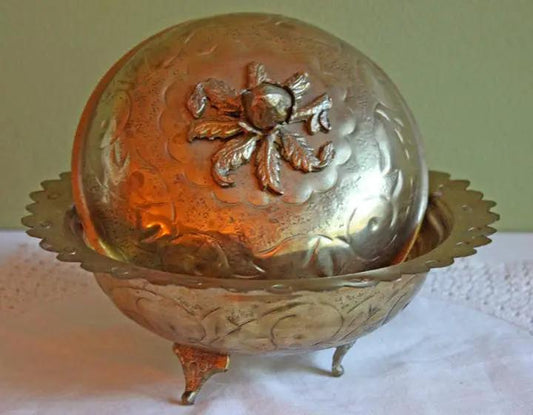 Brass footed bowl with lid, embossed floral motif and acorn knob, three legs on Tampa Home & Garden Store