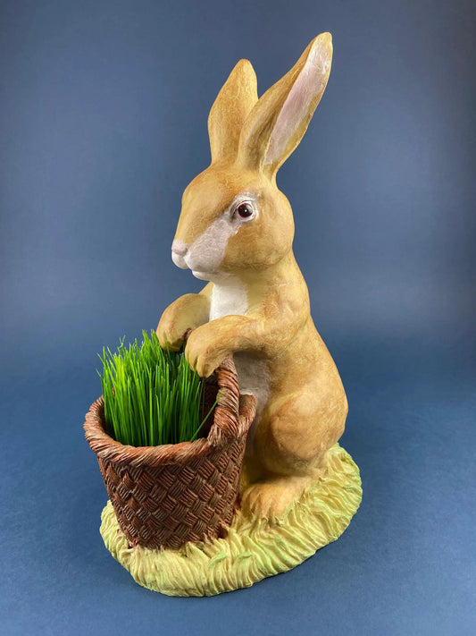 Brown bunny figurine with woven basket and bright green Easter grass, hand-painted finish on Tampa Home & Garden Store